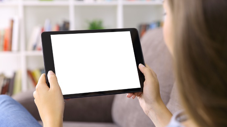 Young woman holding a tablet