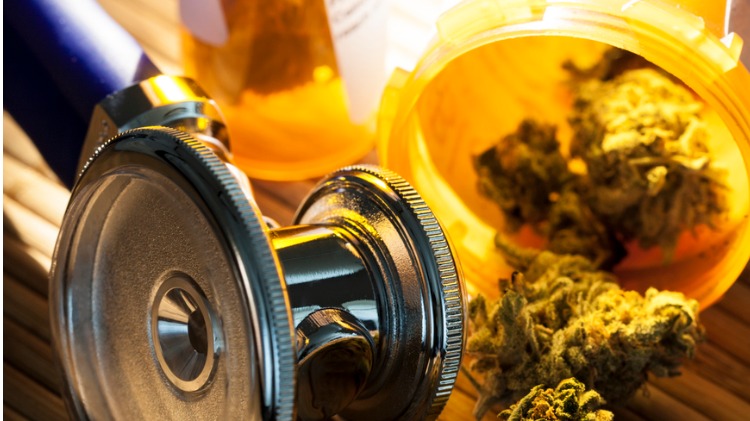 Stethoscope and cannabis on desk