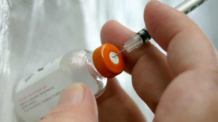 Vaccination bottle and syringe