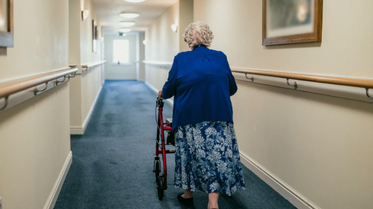 Elderly woman with walker