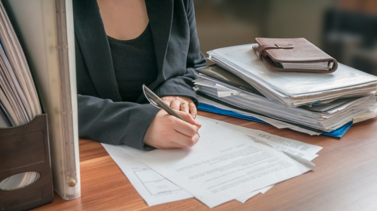 Woman completing paperwork