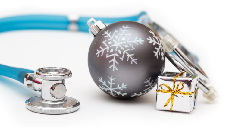 Stethoscope, Christmas ornament and a small wrapped gift