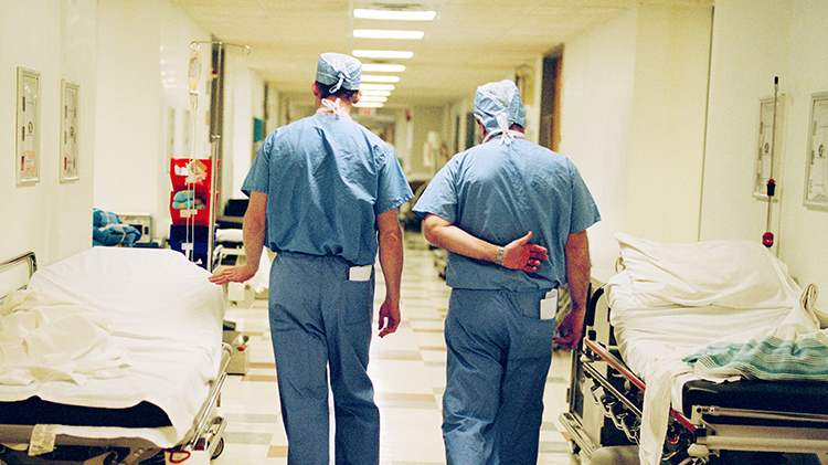 Deflated hospital docs walk down corridor
