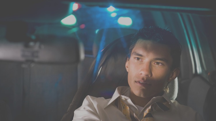 Driver pulls over, cop lights in rear view