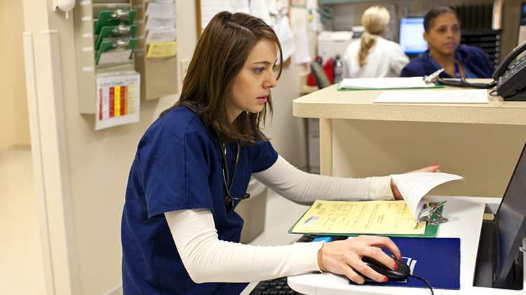 Entering notes at the nurses’ station