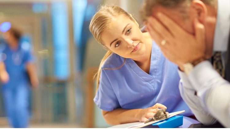 Female doctor supports distressed colleague