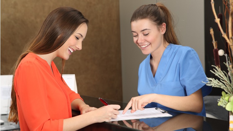 Patient at practice desk