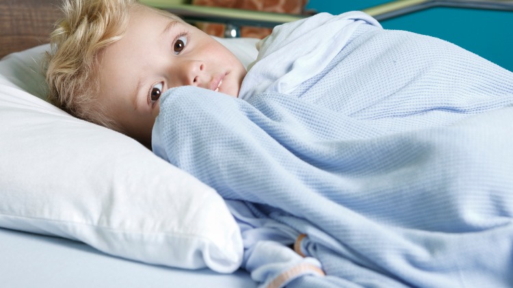 Child in hospital bed