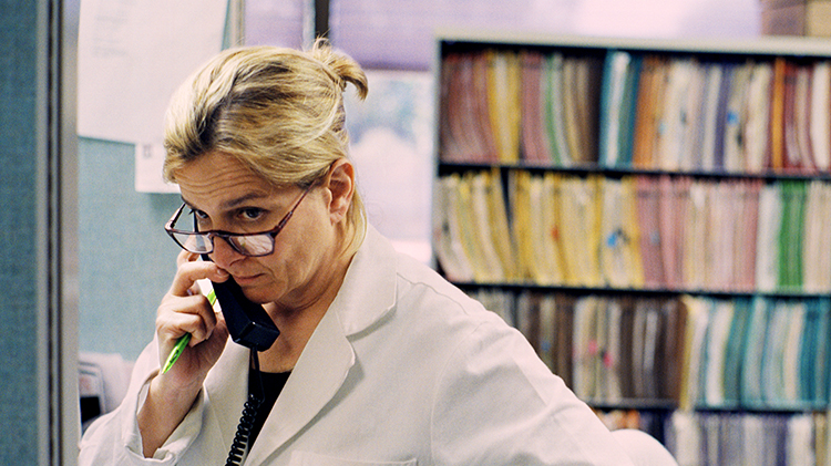 White coat Doctor on the telephone