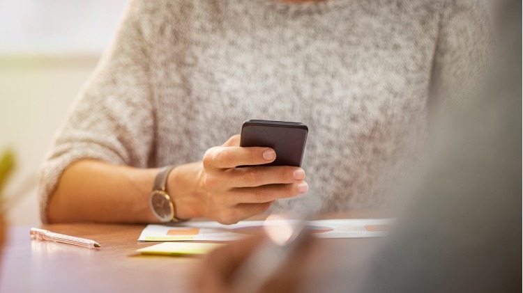 Woman holding mobile phone