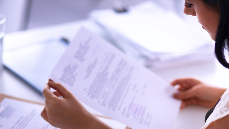 Woman looking at documents