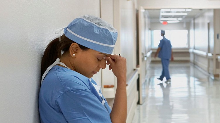 Stressed female doctor in a hospital stetting