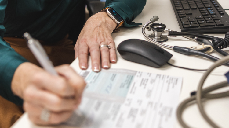Image of doctor writing prescription